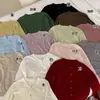 Cárdigan de punto azul lechoso de procesamiento OEM para mujer, atuendo nuevo de principios de otoño 2026, suéter tipo chaqueta de cuello redondo para otoño e invierno