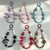 Cadena para teléfono con cara sonriente de dopamina en forma de corazón, pulsera de cuentas con lazo, cadena de muñeca Xiaohongshu, amuleto para bolso, cámara y botella de agua