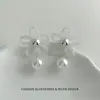 Pendientes minimalistas de temperamento, moda, tejido, flor hueca, tachuelas, 2026, nuevos, nicho, diseño simple, pendientes al por mayor