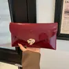 Moda extranjera de moda transfronteriza brillante 2026 gran capacidad nuevo elegante casual moda femenina bolso de mano tipo sobre para axila