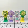 Mini ventilador de mano con diseño de frutas y flores de dibujos animados, con base y soporte para teléfono, portátil para uso en la oficina y en el escritorio del estudiante