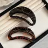 Pasador de concha con hilo de oro para el cabello para mujer 2025 Nuevo Versátil Elegante Simple Pinza de tiburón Nicho Alto Gama Pinza de agarre