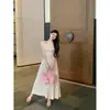 Conjunto de Camiseta de Punto Rosa Off-Shoulder de Primavera Transfronterizo 2026 para Mujer con Falda de Cintura Alta y Broche