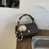 Bolso Pequeño Simple con Patrón de Lichi para Mujer 2026 Nuevo Estilo Bolso de Mano Tipo Almohada Bolso Cruzado Texturizado para Hombro de Principios de Primavera