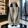 Jeans unisex de pierna ancha, casual, nuevos para primavera/verano, con estampado de leopardo retro transfronterizo, retazos y tres rayas, pierna curva