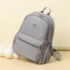Mochila casual transfronteriza para mujer 2026 modelo nuevo de otoño bolsa de nailon simple versátil ligera mochila de moda para damas