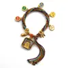 Pulseira do deus da riqueza de cinco vias estilo Xizang oito santos padroeiros cinco mestres Manjushri deus da riqueza amarelo thangka corda tecida à mão pulseira do ano desta vida