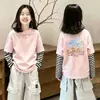 Camiseta de Manga Larga para Niña 2026 Primavera y Otoño Nueva Camiseta con Dibujos Animados para Niños Mayores, Camiseta Básica de Algodón Puro a Rayas Falsa de Dos Piezas