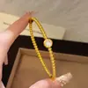 Cuentas redondas doradas simple versátil temperamento con cuentas pulsera en capas pulsera joyería de mano artículo popular de transmisión en vivo lujo ligero diseño exquisito