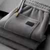 Pantalones casuales gruesos con forro polar transfronterizos para hombre, cálidos para otoño e invierno, holgados, talla grande, pierna recta, cintura elástica, modernos, largos