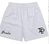 Pantalones cortos de marca de moda estadounidense, pantalones cortos deportivos casuales de malla IP, pantalones cortos de entrenamiento para correr y baloncesto hasta la rodilla para hombres y mujeres.