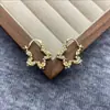 Pendientes de Estrella Calada Envueltos en Perlas Francesas Lujo Accesible Diseño de Nicho Elegantes de Gama Alta Elegantes Exquisitos Pendientes para Mujer