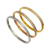Pulsera de acero de titanio de banda fina con una sola piedra, superventas transfronteriza, chapada en oro de 18 quilates para retención del color, versátil para mujeres, disponible para superponer, directo de fábrica