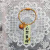 Llavero de acrílico de doble cara con texto de caqui, lindo, creativo y práctico, pequeño regalo, colgante de anillo de alambre