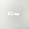 Material de montaje de etiqueta de hueso de vaca pasador de rodillo de hueso de mano pasador caja de brocado hebilla de etiqueta de hueso de plástico fabricantes punto