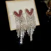 Pendientes colgantes de rombos con borlas tachonados de diamantes de aguja de plata transfronterizos europeos y americanos, pendientes exquisitos y de moda, pendientes versátiles y elegantes al por mayor