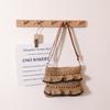 Bolsa de paja con encaje de tirante europeo y americano al por mayor con volantes color verano bolsa de paja bolsa tejida bolsa para vacaciones en la playa junto al mar