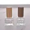 Venta al por mayor de fábrica 10 ml Decantador de perfume Mini tapa de madera maciza Portátil para viajes Botella de perfume Atomizador de niebla fina Botella de vidrio vacía
