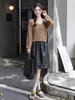Falda midi de cuero lisa y versátil de Feiyuan con volantes para mujer, nueva falda elegante de línea A para commuting de principios de otoño