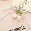 Nuevo Colgante de Teléfono Móvil Tulipán Tejido a Crochet de Lana Colgante para Bolso Serie Miu Cadena Versátil de Colgar para Teléfono Móvil con Lazo