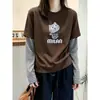 Camiseta Manga Longa Patchwork Listrada Falsa Duas Peças Feminina Outono 2026 Solta Modeladora Senso de Design Camiseta Básica Cartoon