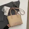 Bolso de mano tipo cubo nuevo de primavera 2026, transfronterizo, estilo vintage simple, de alta gama, moderno, para ir al trabajo, bolso de hombro cruzado de moda