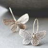 Pendientes de mariposa plateados exagerados de temperamento retro de moda europea y americana, populares para mujer, venta directa de fábrica