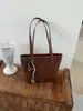 Bolso tote vintage de nicho coreano transfronterizo para mujer, nuevo bolso casual de moda para el día a día con patrón tejido, bolso de hombro para llevar debajo del brazo