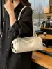 Bolsa de Mão Versátil Casual Simples Bolsa Baguete para Mulheres Outono 2025 Nova Textura de Alta Qualidade Luxo Leve Bolsa de Ombro/Axila
