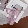 Nova Tanga Sexy de Cor Sólida Macia de Seda de Gelo para Mulheres de Cintura Baixa Sem Costura Divertida com Pom-Pom Fofa Calcinha T para Mulheres