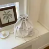 Bolso biker de PU de gran capacidad con cordón, modelo nuevo 2026, bolso tipo cubo de alta gama, mochila de moda para el día a día