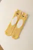 Calcetines de Invierno Otoño Nuevos de Dibujos Animados con Orejas 3D de Felpa Coral de Media Pantorrilla para Mujer Calcetines de Piso Cálidos Gruesos Lindos al por Mayor