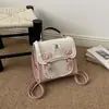 Bolsa de Ombro Dupla Doce Exquisita Super Popular de Nicho Feminina 2026 Nova Mini Versátil para o Dia a Dia Mochila Transversal Pequena Bolsa Escolar