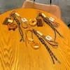 Miu wind alkali water bread llavero hebilla bagel cuerda tejida de chocolate moda colgante para mochila escolar regalo de graduación