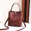 Bolsos para Mujer 2025 Primavera y Verano Nueva Moda Bolso Cubo Estilo Coreano para Mujer Patrón de Piedra Portátil Bolso de Hombro Cruzado Bolso de Hada