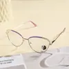Gafas de alambre dorado estilo ojo de gato de alta gama refinado pícaro montura metálica anti-luz azul monturas de gafas retro europeas y americanas para mujer
