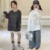 Camiseta de Manga Longa com Estampa de Letras Estilo Coreano para Meninas, Primavera 2026, Top Casual Simples Soltinho, Moda Transfronteiriça Tendência