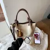 Bolso de hombro casual de nicho simple y elegante transfronterizo, nuevo bolso de mano popular estilo coreano otoño 2026, bolso de moda