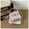 Bolso de mano cuadrado pequeño de color liso moderno estilo coreano 2026 nuevo diseño de nicho moda bandolera para mujer