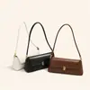 Fábrica de Guangzhou OEM bolsas personalizadas para mujer, bolsos cruzados, bolsos de hombro tipo baguette versátiles para mujer, bolsos de axila de moda para el trabajo al por mayor