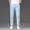 Pantalones Casuales Cortos Blancos de Primavera Hong Kong para Hombre 2026 Nuevos Pantalones Elásticos Rectos Ajustados Estilo Primavera y Otoño