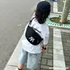 Bolso para niños, estilo coreano, con letras, sencillo e informal, tipo bandolera, mochila para niño, elegante y a la moda, para el pecho del bebé.