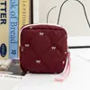 Bolsa de almacenamiento acolchada con forma de lazo para toallas sanitarias, neceser de viaje portátil, bolsa multifuncional para labiales y maquillaje