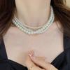 Collar de perlas retro francés para mujer, cadena de clavícula ligera de lujo con diseño de nicho, estilo popular 2025.