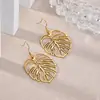 Brincos Personalizados Vazados em Forma de Folha Europeus e Americanos de Venda Quente Transfronteiriça para Mulheres, Brincos Banhados a Ouro 18K em Aço Inoxidável, Novos Produtos da Moda