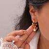Pendientes de Acero de Titanio con Diseño de Hierba de la Suerte Geométrica de Personalidad y Temperamento, de Venta Caliente Transfronteriza, Versátiles, Incrustados con Cuentas