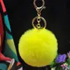 Al por mayor en stock Bola de pelo de imitación de conejo Rex de 8 cm llavero colgante lindo para mujer bolso de coche teléfono móvil colgante de felpa