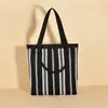Bolso de Mano de Punto Rayado para Mujer Lujo Ligero Nicho Gran Capacidad para Viajar al Trabajo Hombro Doble Uso Tejido Fly Bolso Tote con Patrón Vertical