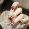 Set de 10 Piezas de Uñas Postizas Premium Hechas a Mano con un Look Sofisticado, Presentando Moños 3D, Cadenas de Pedrería y Diseño Ojo de Gato