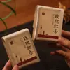 Set de regalo del Festival de Medio Otoño con pequeñas latas redondas de té, caja de regalo de té estilo chino con té enlatado para personas mayores